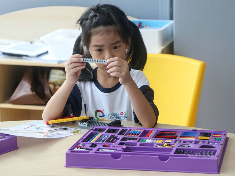 Student focused on building with Young Engineers kit