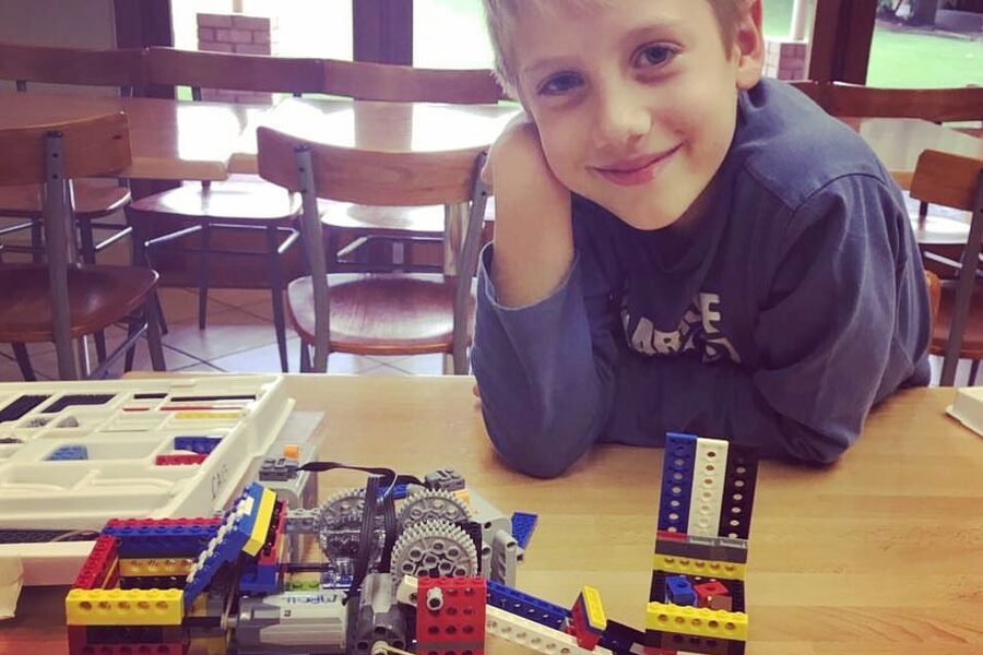 Proud student showing completed Galileo Technic build